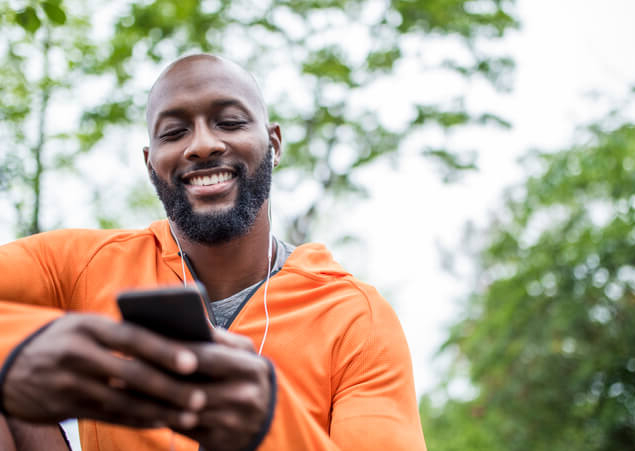 active male looking at phone