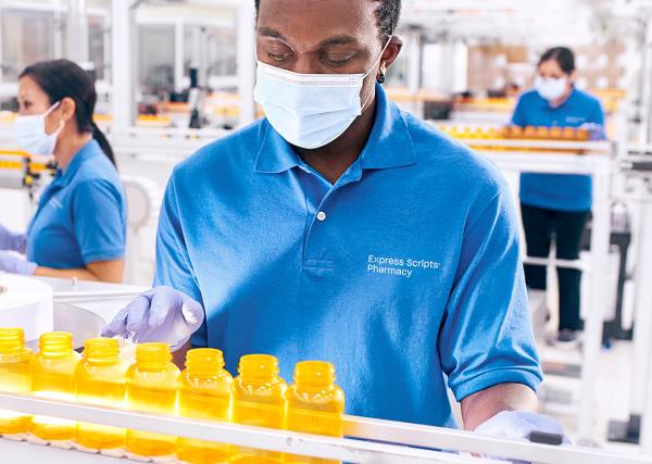 Pharmacists and pharmacy technicians at work in one of Express Scripts® Pharmacy’s fulfillment locations.