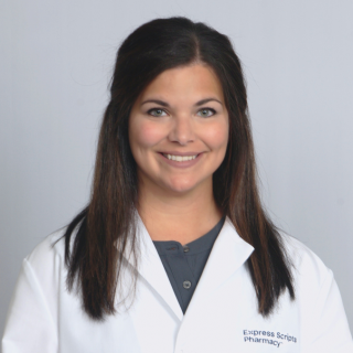 Anna Evans, a registered pharmacist, smiles while wearing her Express Scripts® Pharmacy lab coat.