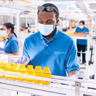 Pharmacists and pharmacy technicians at work in one of Express Scripts® Pharmacy’s fulfillment locations.
